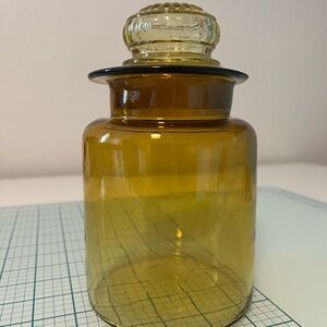 Vintage Takahashi Japan 1960 amber glass apothecary jar with a daisy-shaped lid.